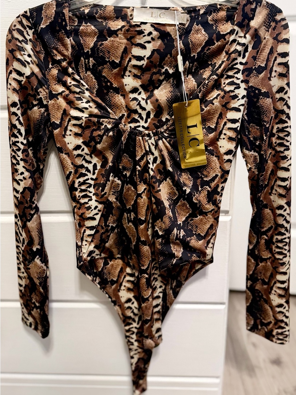 Woman’s One-Piece Long Sleeve Bodysuit in Brown Snake Print